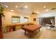 View of the recreation room with billiards table, seating and decorative ceiling fan at 625 30Th W Ave # G210, Bradenton, FL 34205