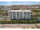 Stunning aerial view of the building highlighting its architecture and proximity to the water at 6415 Midnight Pass Rd # 204, Sarasota, FL 34242