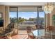 Balcony view featuring sliding glass doors, seating, and serene views of the surrounding area at 6415 Midnight Pass Rd # 204, Sarasota, FL 34242