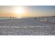 Wide sandy beach with vacationers enjoying the sun near the clear turquoise ocean and open horizon at 6415 Midnight Pass Rd # 204, Sarasota, FL 34242