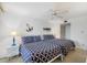 Bright bedroom with two beds, coastal decorations, and comfortable decor at 6415 Midnight Pass Rd # 204, Sarasota, FL 34242