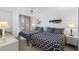 Inviting bedroom showcasing two beds, seaside decor, and lots of natural light at 6415 Midnight Pass Rd # 204, Sarasota, FL 34242