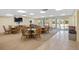 Bright clubhouse with ample seating, tables, and large windows offering views of the outdoors at 6415 Midnight Pass Rd # 204, Sarasota, FL 34242