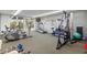 Well-equipped exercise room featuring various machines and natural light, perfect for staying active at 6415 Midnight Pass Rd # 204, Sarasota, FL 34242