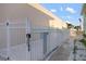 Security fence surrounds property on the beach, providing protection with keypad access and pedestrian gate at 6415 Midnight Pass Rd # 204, Sarasota, FL 34242