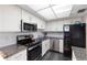 Well-equipped kitchen with stainless steel appliances, modern finishes, and granite countertops at 6415 Midnight Pass Rd # 204, Sarasota, FL 34242