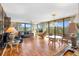 Bright living room with hardwood floors, large windows, and comfortable seating arrangements at 6415 Midnight Pass Rd # 204, Sarasota, FL 34242
