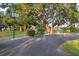 Park featuring a basketball court and mature trees at 6415 Midnight Pass Rd # 204, Sarasota, FL 34242