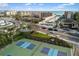 Community tennis and pickleball courts with lush landscaping and nearby beach access at 6415 Midnight Pass Rd # 204, Sarasota, FL 34242