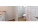 Bright bathroom featuring modern fixtures, wood-look tile flooring, and white marble vanity at 654 Jungle Queen Way, Longboat Key, FL 34228