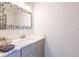 Stylish bathroom vanity with a modern framed mirror and marble countertop for an elegant touch at 654 Jungle Queen Way, Longboat Key, FL 34228