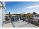 Rooftop deck with outdoor furniture and waterfront views, perfect for relaxation and entertaining at 654 Jungle Queen Way, Longboat Key, FL 34228