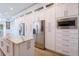 Modern kitchen features stainless appliances, marble countertops, and white cabinets at 654 Jungle Queen Way, Longboat Key, FL 34228
