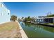 Scenic view of a waterfront canal with lush greenery and private docks lining the waterway at 654 Jungle Queen Way, Longboat Key, FL 34228