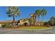 Inviting clubhouse entrance with lush landscaping and prominent architectural details at 6914 Grand Estuary Trl # 101, Bradenton, FL 34212