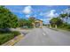 Gated community entrance with meticulous landscaping providing a secure and visually appealing welcome at 6914 Grand Estuary Trl # 101, Bradenton, FL 34212