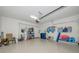 Spacious garage with overhead storage, epoxy flooring, and ample room at 6914 Grand Estuary Trl # 101, Bradenton, FL 34212