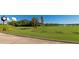 Scenic golf course view with manicured green fairways and serene lake backdrop at 6914 Grand Estuary Trl # 101, Bradenton, FL 34212