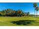 Picturesque golf course featuring well-maintained greens and a tranquil lake view at 6914 Grand Estuary Trl # 101, Bradenton, FL 34212