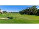 Expansive golf course featuring lush green grass, sand traps and clear blue skies in the distance at 6914 Grand Estuary Trl # 101, Bradenton, FL 34212