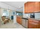 Cozy kitchen with granite countertops, stainless steel appliances, and a view to the dining area at 6914 Grand Estuary Trl # 101, Bradenton, FL 34212