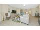 Spacious living room with neutral decor, tile floors, and a ceiling fan at 6914 Grand Estuary Trl # 101, Bradenton, FL 34212