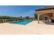 Inviting community pool surrounded by ample seating and lush landscaping, perfect for relaxation and recreation at 6914 Grand Estuary Trl # 101, Bradenton, FL 34212