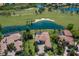 Expansive estate showcasing a pool, lush landscaping, and golf course views, capturing luxury living at its finest at 7218 Teal Creek Gln, Lakewood Ranch, FL 34202