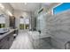 A luxurious primary bath boasts granite counters, walk-in glass shower, and a soaking tub at 7218 Teal Creek Gln, Lakewood Ranch, FL 34202