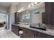 Modern bathroom featuring double vanity, sleek countertops, glass shower and lots of space at 7218 Teal Creek Gln, Lakewood Ranch, FL 34202