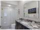 Bathroom features a glass enclosed shower and granite countertops at 7218 Teal Creek Gln, Lakewood Ranch, FL 34202