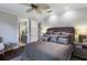 A lovely bedroom with a ceiling fan provides direct access to an en-suite bathroom at 7218 Teal Creek Gln, Lakewood Ranch, FL 34202
