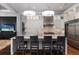 Eat-in kitchen features new appliances, countertops, and a sleek design with bar stool seating at 7218 Teal Creek Gln, Lakewood Ranch, FL 34202