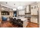 Gourmet kitchen with a large center island, stainless steel appliances, and custom cabinetry at 7218 Teal Creek Gln, Lakewood Ranch, FL 34202