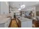 Contemporary kitchen featuring stainless steel appliances, marble countertops and backsplash, and a spacious center island at 7218 Teal Creek Gln, Lakewood Ranch, FL 34202