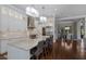 Bright, modern kitchen with marble countertops, stainless steel appliances, and an expansive island at 7218 Teal Creek Gln, Lakewood Ranch, FL 34202