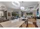 Spacious kitchen with a large island, stainless steel sink, and views of the pool and backyard at 7218 Teal Creek Gln, Lakewood Ranch, FL 34202