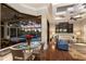 Inviting living area with pool view, wet bar, and comfortable seating, perfect for entertaining at 7128 Teal Creek Gln, Lakewood Ranch, FL 34202