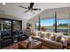 Comfortable living room with plush seating, golf course view, and screened-in patio at 7218 Teal Creek Gln, Lakewood Ranch, FL 34202