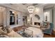 Stylish living room featuring modern lighting, comfortable seating, and decorative accents at 7218 Teal Creek Gln, Lakewood Ranch, FL 34202