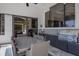 Outdoor kitchen with stainless steel grill, dining area, and ample countertop space at 7218 Teal Creek Gln, Lakewood Ranch, FL 34202