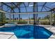 Enclosed swimming pool and spa overlooking a golf course at 7218 Teal Creek Gln, Lakewood Ranch, FL 34202
