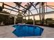 Stunning swimming pool with a spa, screened enclosure, and beautiful views at 7218 Teal Creek Gln, Lakewood Ranch, FL 34202