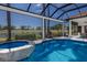 Enclosed swimming pool and spa overlooking a golf course at 7218 Teal Creek Gln, Lakewood Ranch, FL 34202