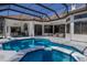 Beautiful swimming pool and spa in an outdoor living space with tile surround at 7218 Teal Creek Gln, Lakewood Ranch, FL 34202