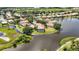 Aerial view of the community, showcasing a home on a peninsula surrounded by water at 7231 Brambury Ct, Sarasota, FL 34238