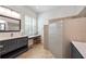 Well-lit bathroom features a vanity, lots of counterspace, a make-up counter, and an expansive shower space at 7231 Brambury Ct, Sarasota, FL 34238