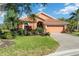 Charming home featuring a beautifully landscaped front yard and a brick driveway at 7231 Brambury Ct, Sarasota, FL 34238