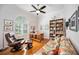 Home office with a bookshelf, desk, reclining chair, and a large window offering plenty of light at 7231 Brambury Ct, Sarasota, FL 34238