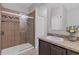 This bathroom features a tiled shower with glass doors and neutral colors throughout at 7418 61St E St, Palmetto, FL 34221